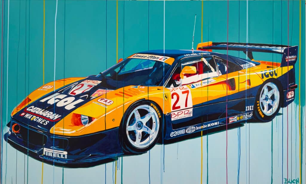 Colorful race car mural with orange, blue, and yellow livery against a teal background with vertical paint drips and sponsor logos on the car's body.
